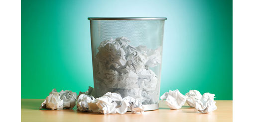 screwed up paper in office bin