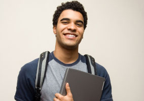 A male student having given a good informative speech