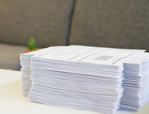 Pile of Handouts on Desk